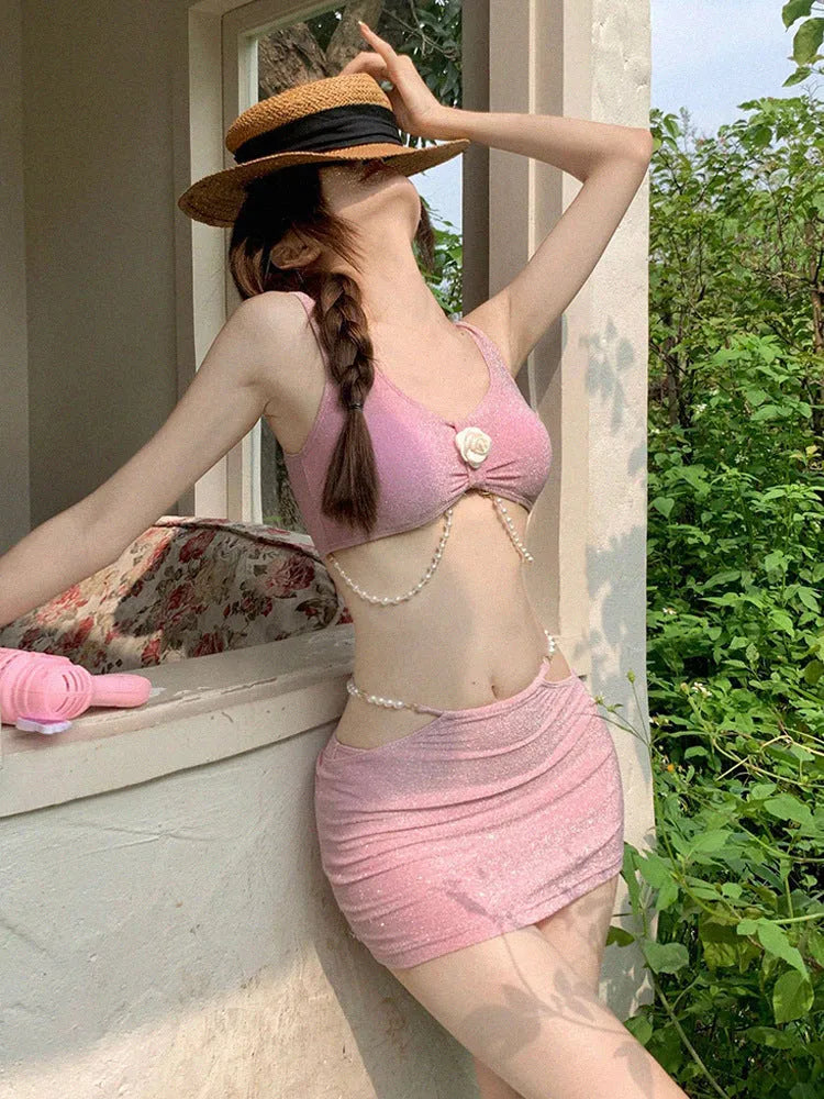 Women's three-piece bikini swimsuit set in pink and black colours with briefs style bottoms
