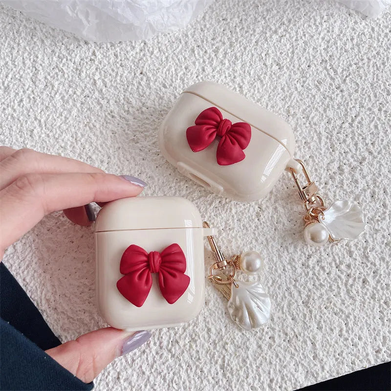 Beige red bow shell TPU AirPods case cover with clamshell design for AirPods 3, Pro 3, and 1/2 models