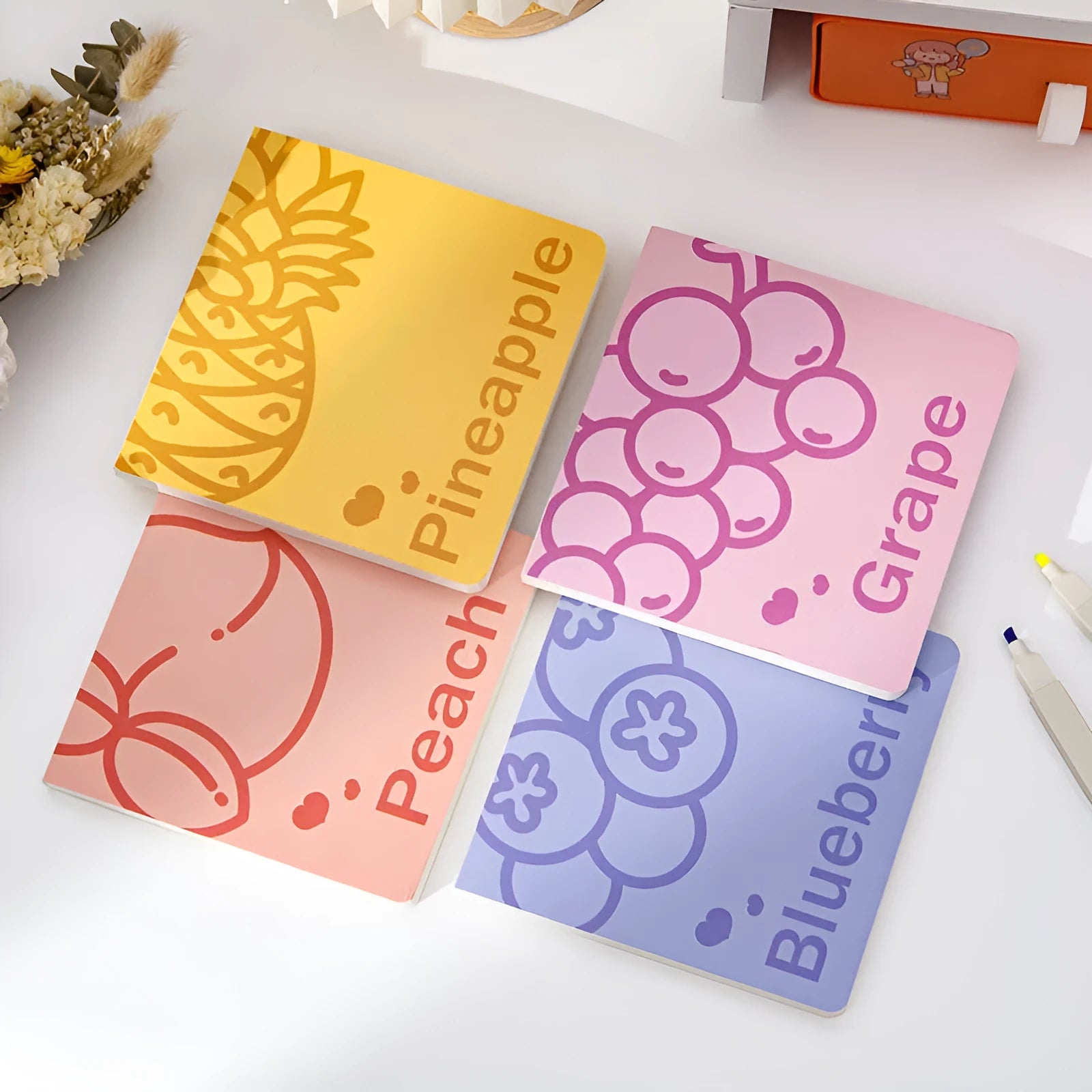 Square notebook with embossed fruit design cover, showing 14.5 cm size and thickened paper pages.