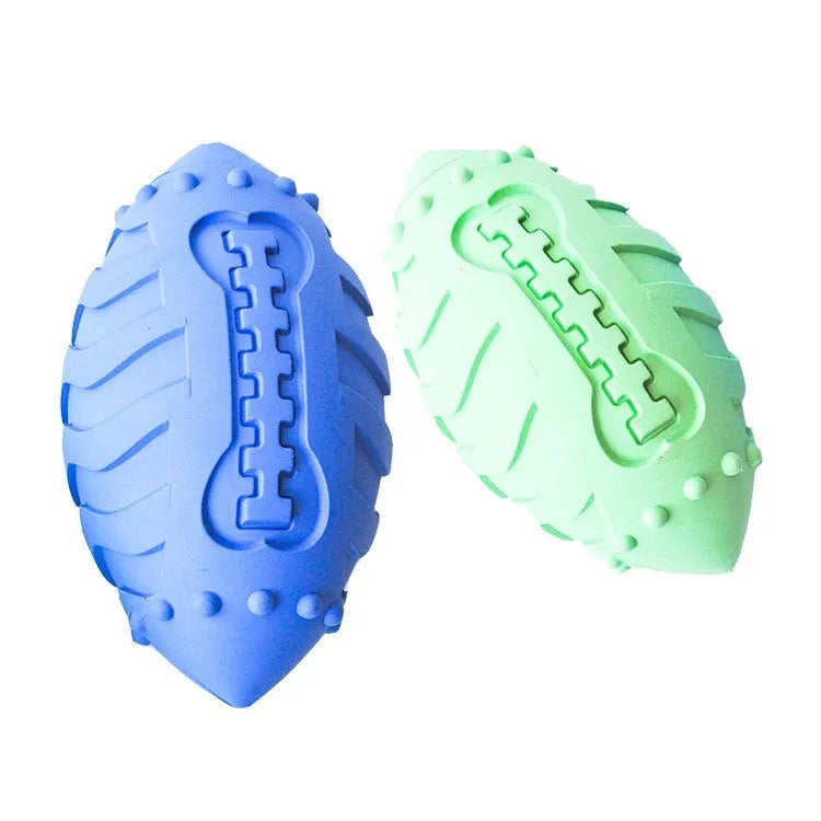 Light green rugby-shaped rubber dog toy with bite-resistant texture for chewing and interactive play