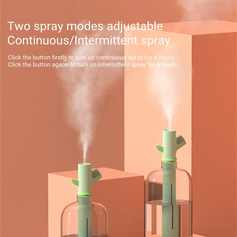 Transparent mini USB humidifier with water bottle design showing adjustable mist output