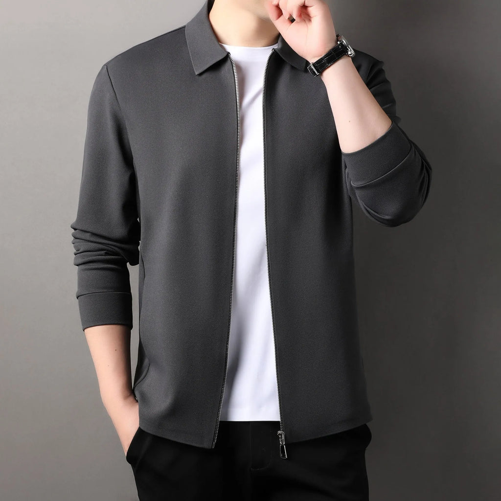 Men's apricot-coloured polyester business jacket with long sleeves and a straight hem on a hanger.