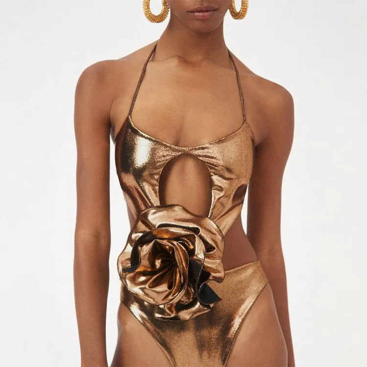 Gold halter neck one-piece swimsuit with hollow out design on mannequin