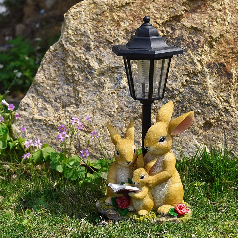 Solar garden lamp with resin figurine in American country style design