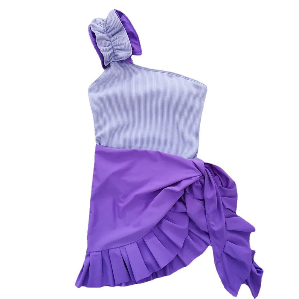 Women's solid colour single-shoulder suspender tube top one-piece swimsuit on a mannequin.