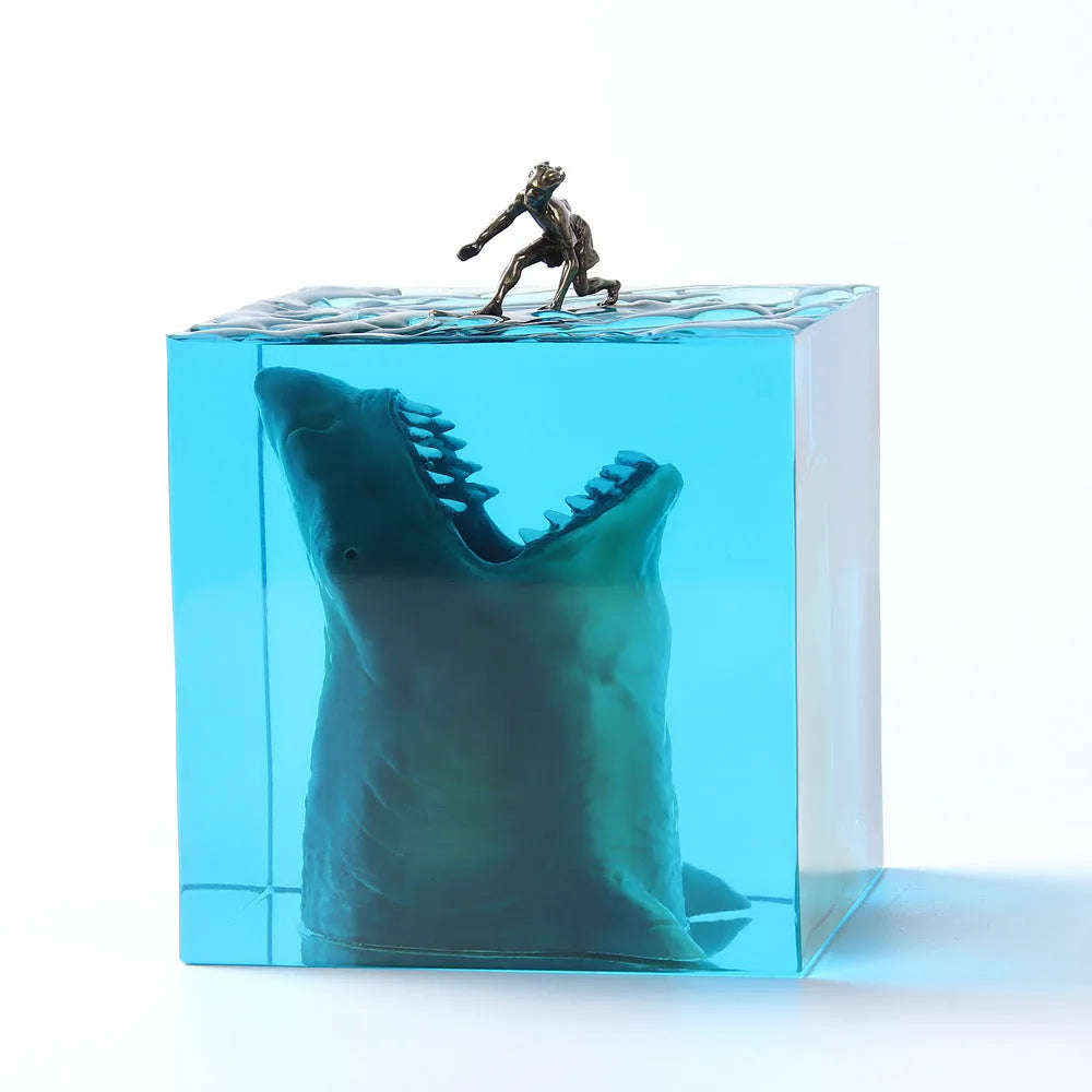 Epoxy resin shark surf scene night light ornament in 5cm and 8cm sizes on a table.
