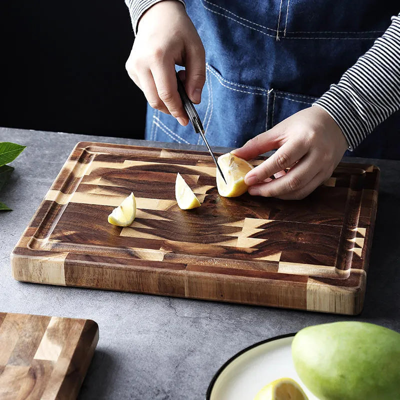 Brown solid acacia wood chopping board with 3cm thickness on a kitchen countertop