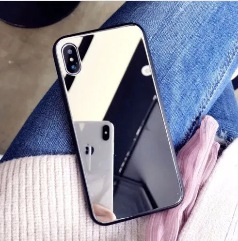 Black iPhone case with a reflective mirror surface on the back, compatible with iPhone X, 7, and 8 Plus.