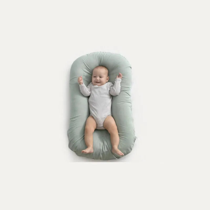 Beige portable cotton baby nest bed crib for newborns, measuring 75 cm by 45 cm.