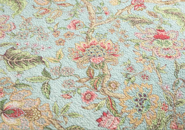 Blue cotton bedspread with floral patterns and quilted texture in American style bedding set