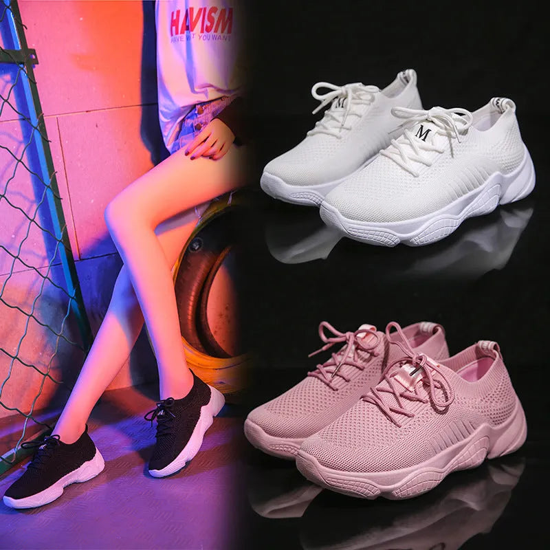 Women's white thick-soled sports shoes with flying woven upper and front strap.