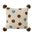 Blue cartoon animal print square sofa cushion on a grey sofa.