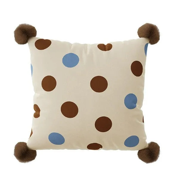 Blue cartoon animal print square sofa cushion on a grey sofa.