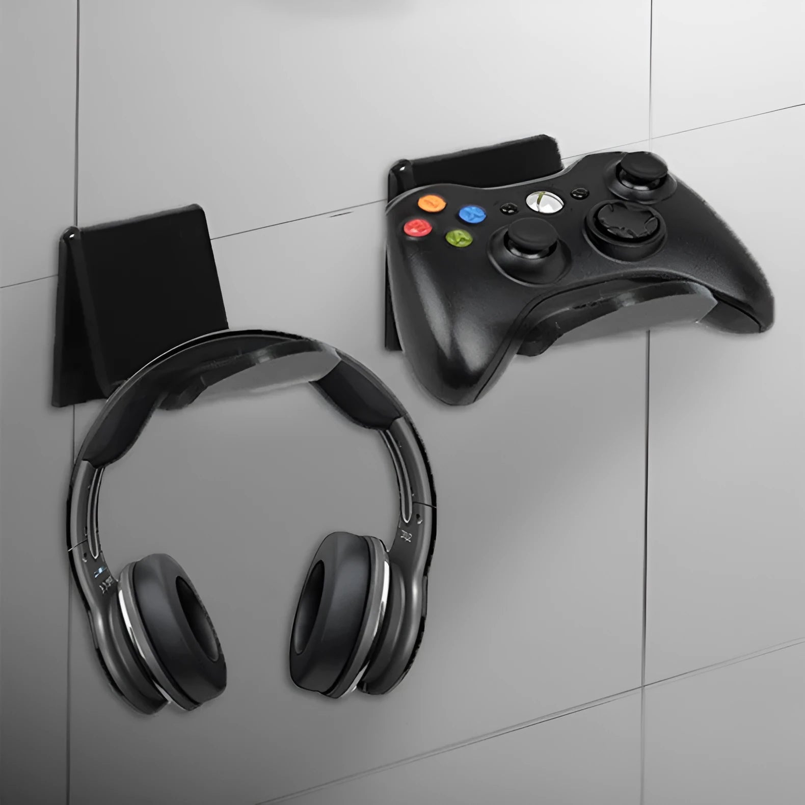Universal plastic wall mount bracket for game controllers in black, white and transparent colours.