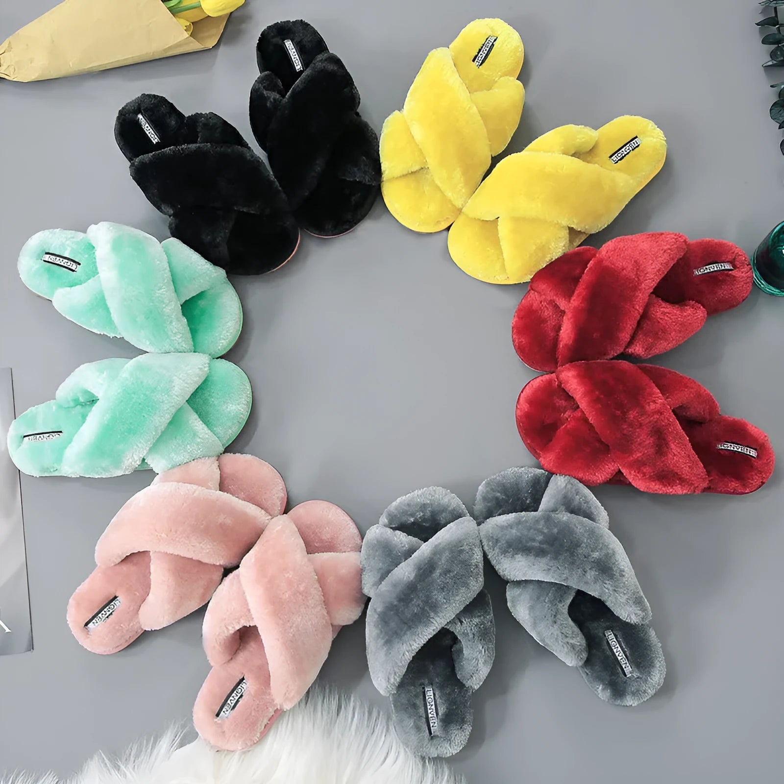 Cross open-toe fur slippers in pink with textured fur and patterned anti-slip sole.
