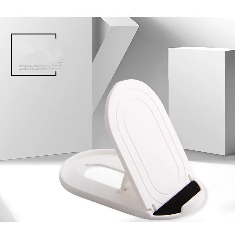 A plastic lazy bracket phone stand holding a mobile smartphone on a table.