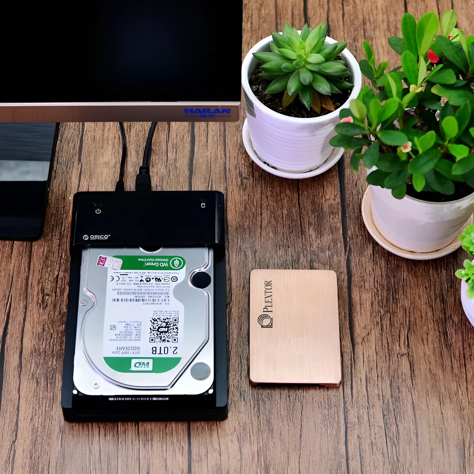 Black plastic 2.5-inch SATA hard drive enclosure with USB 3.0 cable for portable external storage