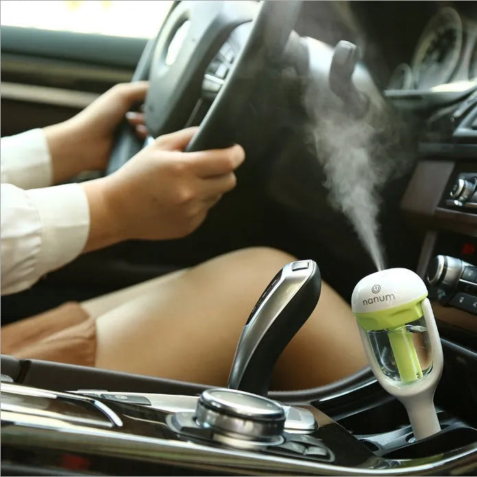 Portable car humidifier with air purifier functions in blue, green, pink or purple colours