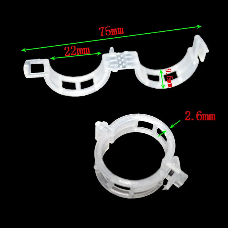 Set of 50 green plastic plant grafting clips for securing tomato vines and garden plants.