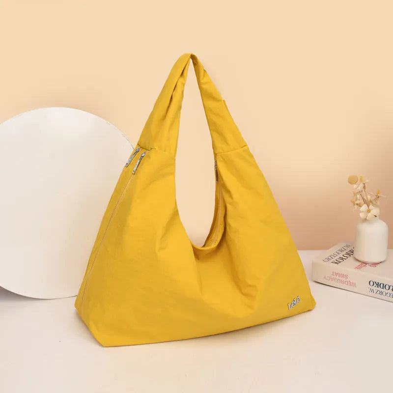 Women's heart-shaped underarm bag in nylon with large capacity, shown in available colours