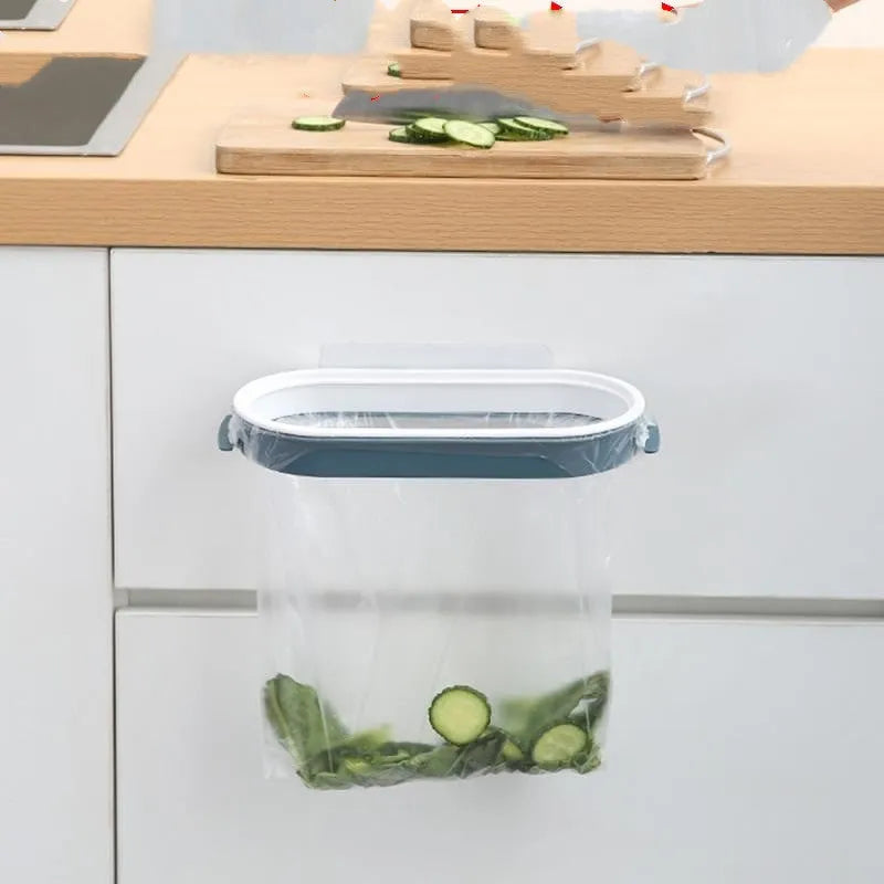 Blue kitchen plastic garbage bag storage rack on a cabinet door.
