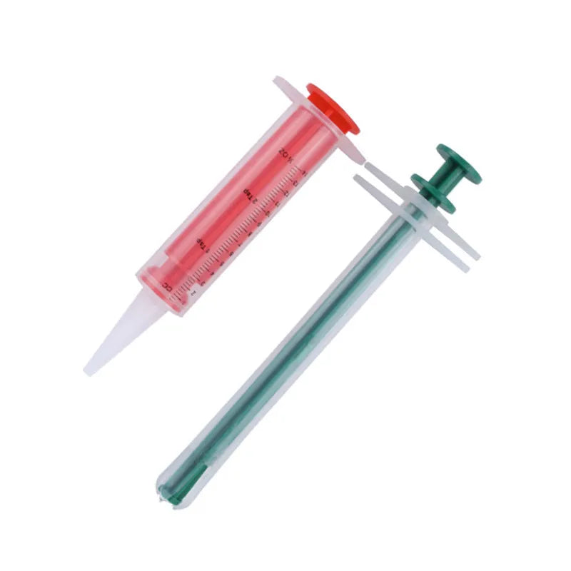 Two pet pill shooters with soft silicone tips, different sizes, for administering medicine to cats and dogs.