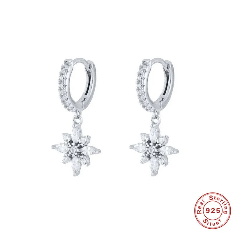 A pair of women's S925 sterling silver snowflake pendant earrings with a geometric design, available in yellow gold or white gold colour finishes.