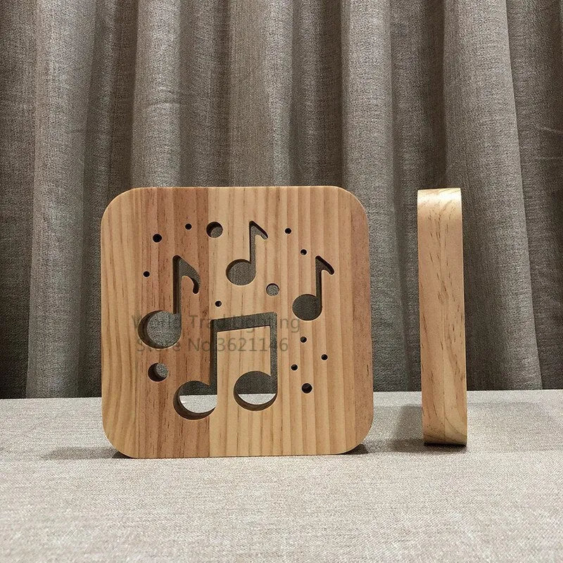Square pine wood USB LED atmosphere lamp emitting warm white light, showing its 3D design and button switch.