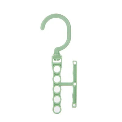 Blue revolving plastic wardrobe hanger with five hooks and a central handle for rotating.