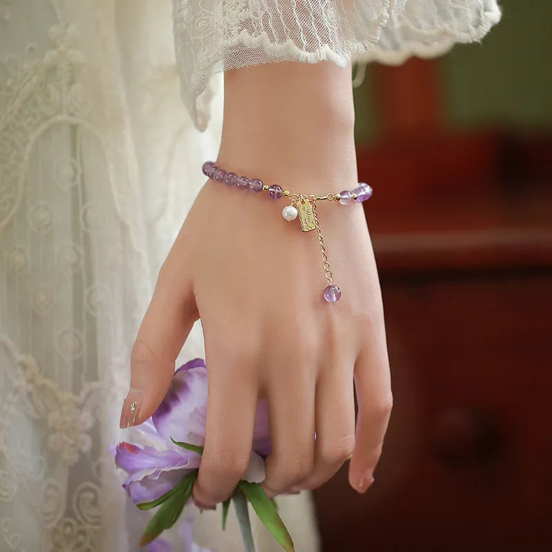 Women's lavender amethyst crystal bracelet with animal zodiac design in dark and light colour options