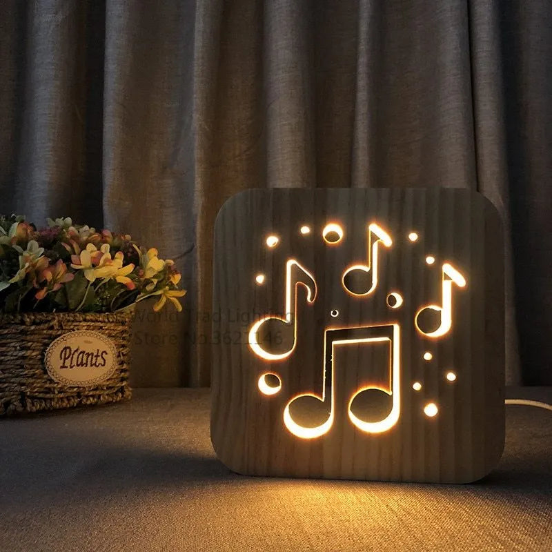 Square pine wood USB LED atmosphere lamp emitting warm white light, showing its 3D design and button switch.