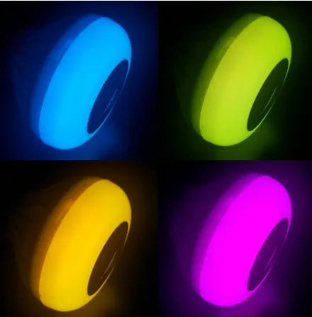 White smart LED bulb with Bluetooth speaker and remote control showing E27 screw base