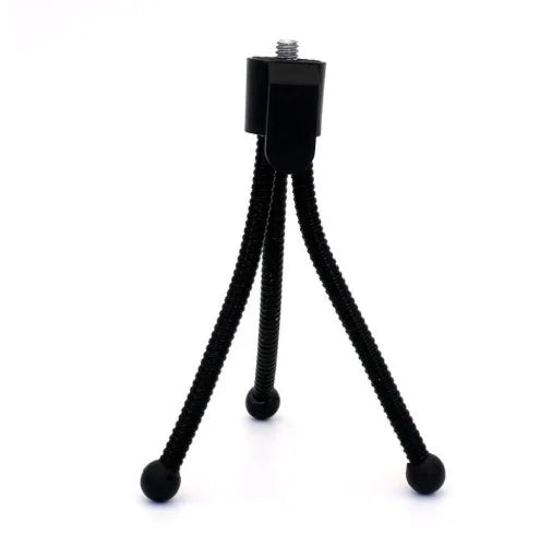 Small black iron frame mini tripod with ball head, shown folded and extended next to a smartphone.