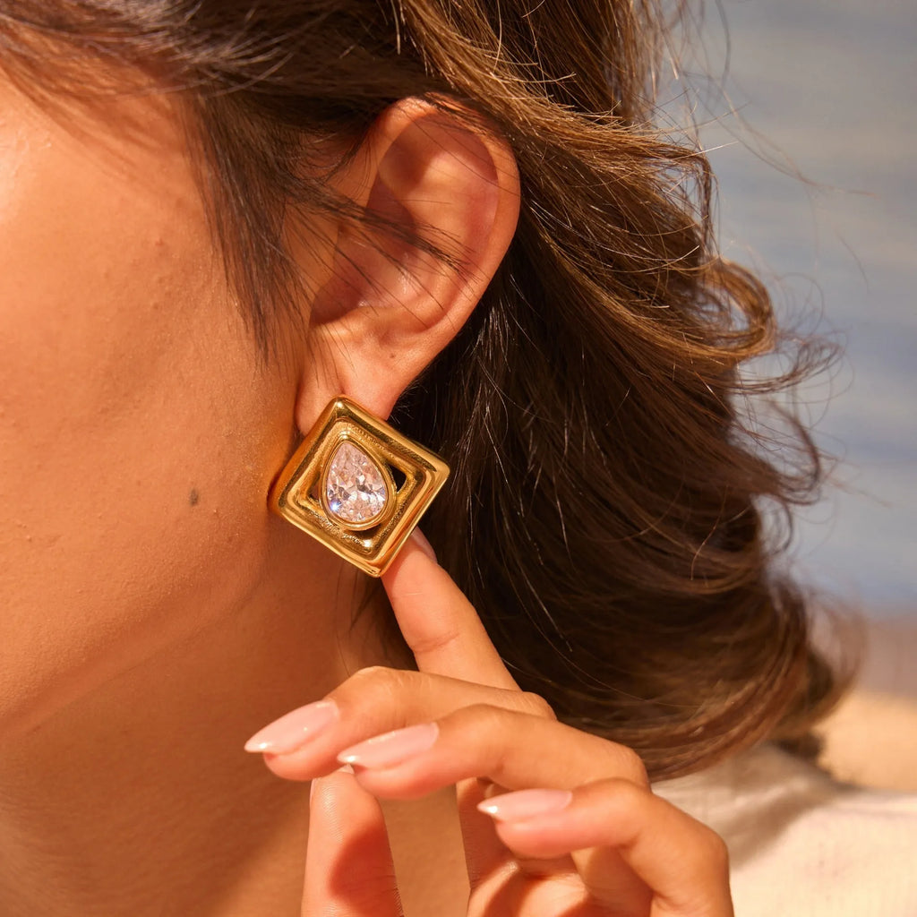 Gold electroplated stud earrings with geometric water drop zircon stone patterns