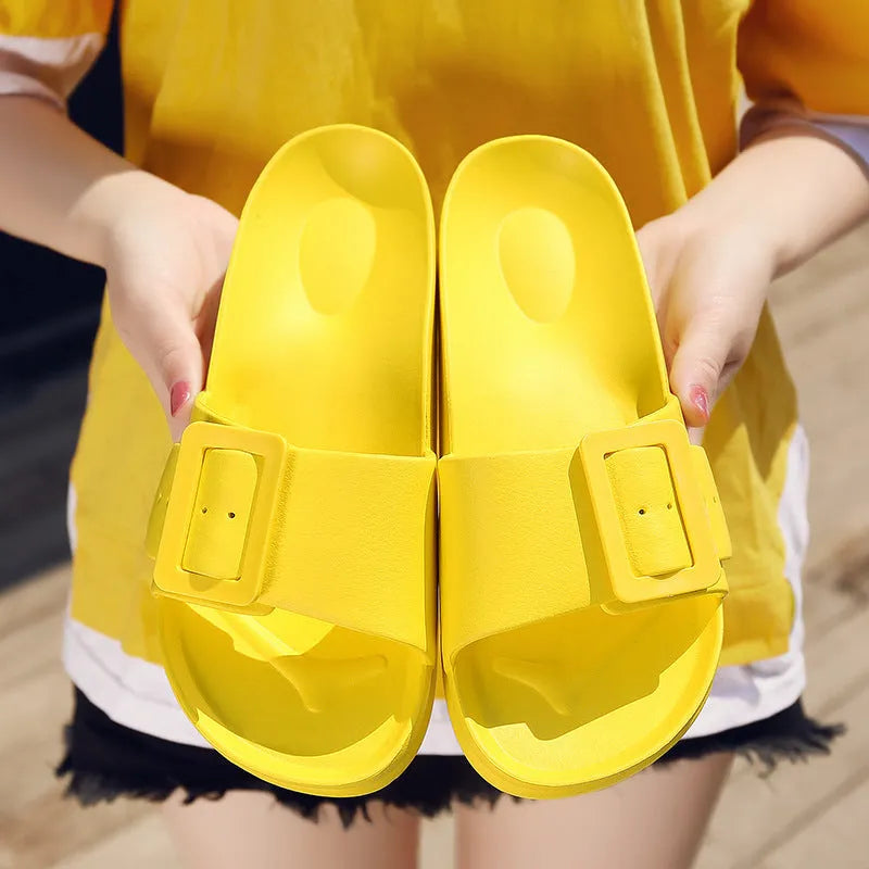 Women's grey blue buckle closure slipper sandals with soft EVA sole on a plain background.