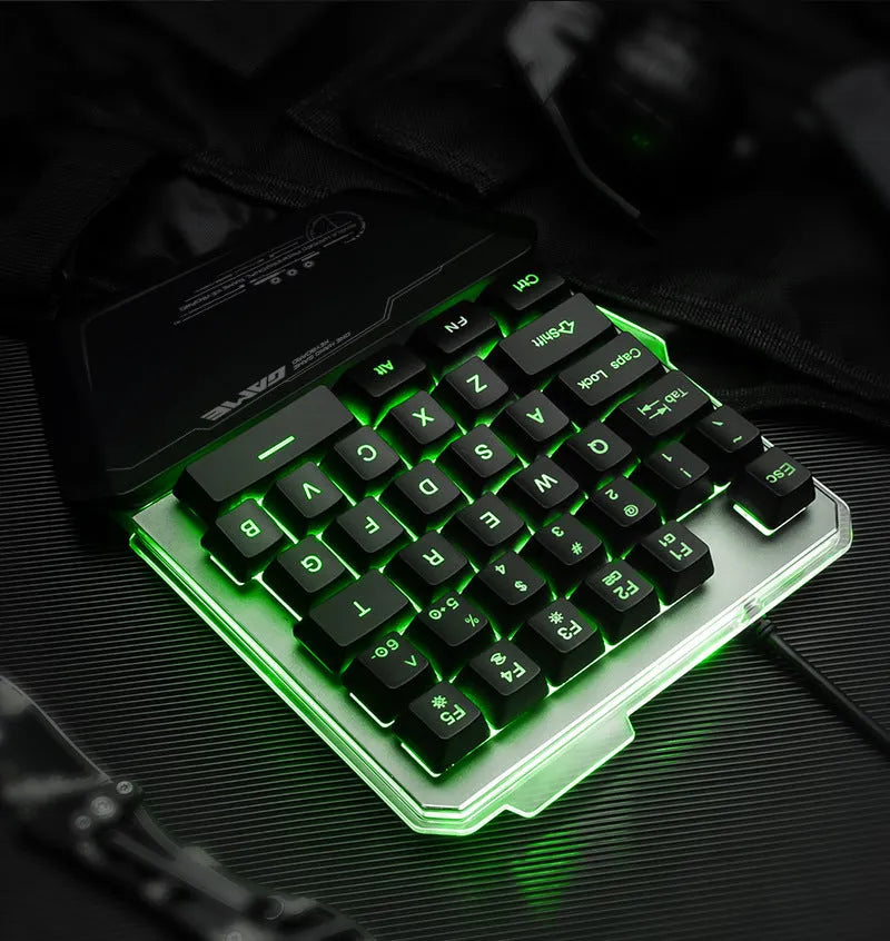 Black G40 one-handed mechanical keyboard with RGB backlighting on a desk.