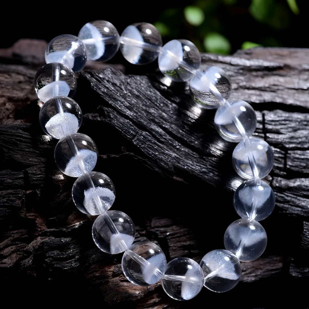 Women's white crystal ghost pyramid bracelet with Ruyi design element showing multiple purity size options
