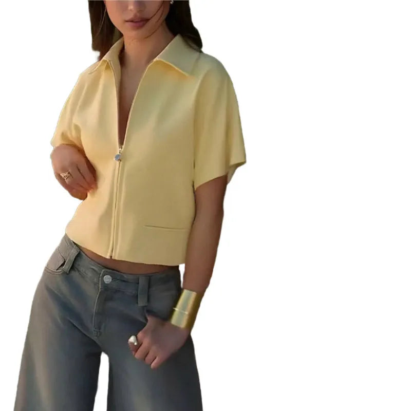 Loose-fit casual top with short sleeves in polyester fabric showing black, white, and yellow colour options