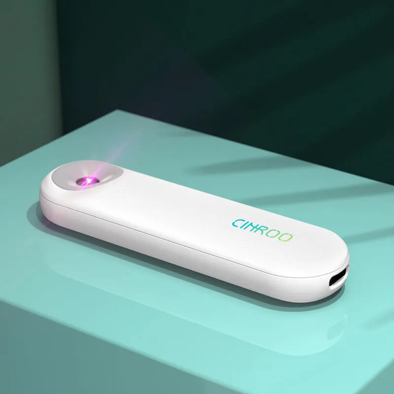 White Spot portable ultraviolet steriliser lamp showing compact dimensions next to a mobile phone for scale.