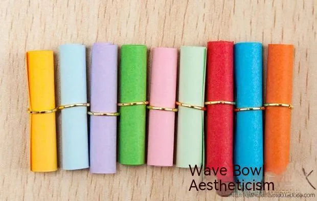 Colourful assortment of small rolled paper scrolls with central holes for drift bottle messages