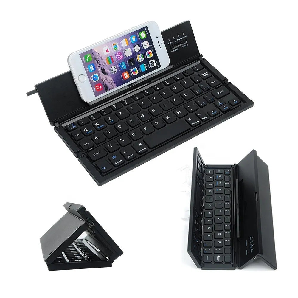 Black folding Bluetooth keyboard with numeric pad next to tablet