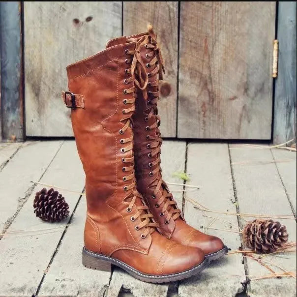Women's black chunky heel high leg ankle boots with a round toe and low rubber sole.