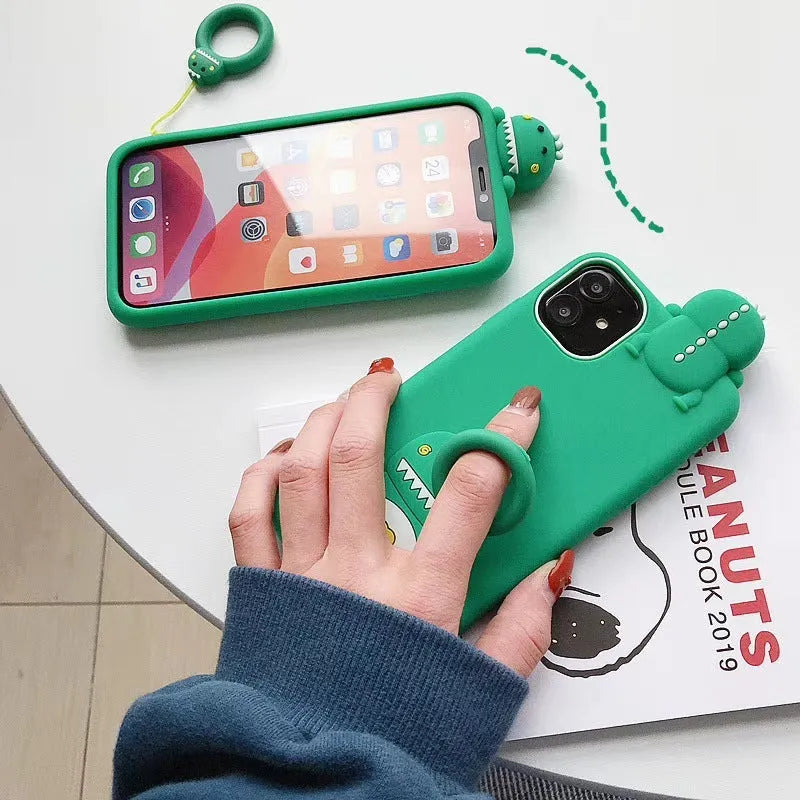 Green and yellow silicone iPhone cases with cartoon animal designs for waterproof, drop-resistant protection.