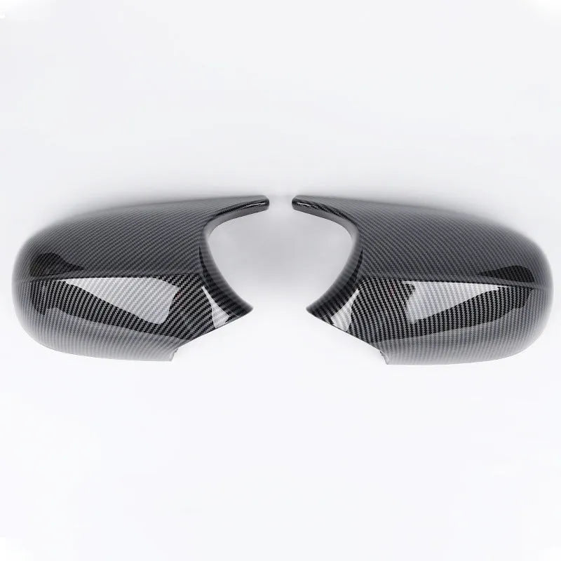 Pair of black ABS plastic rearview mirror shells for BMW 3 Series E90 car.