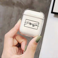 Transparent plastic AirPods protective cover showing Apple device inside with colour variation options