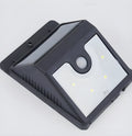 Set of four white solar-powered outdoor security lights with stainless steel mounting brackets
