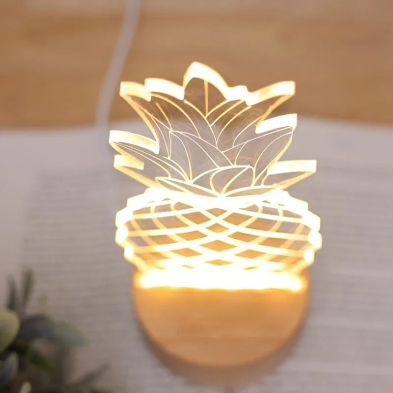 Wood and acrylic pineapple-shaped USB table lamp with dimmer switch on a bedside table.