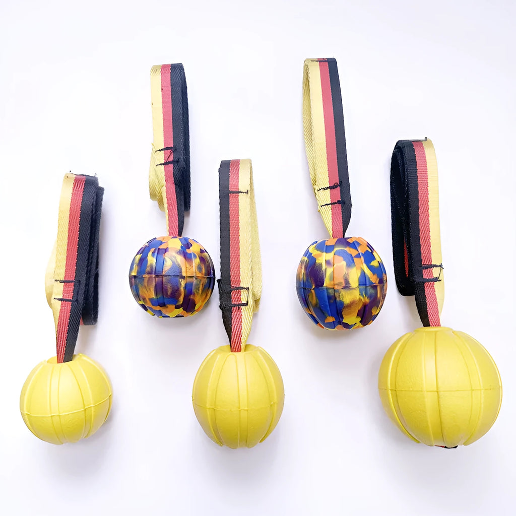 Floating EVA foam dog training ball in camouflage and yellow colours showing three size options