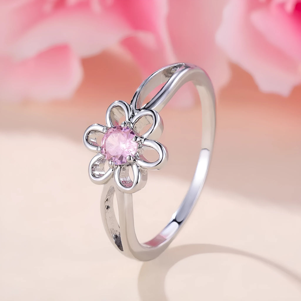 Women's flower-shaped hollow-out copper fashion ring in platinum pink diamond colour.