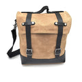 Waterproof canvas motorcycle side bag in black with cowhide accents and mounting straps